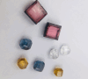 Examples of fancy-coloured CVD diamond gemstones.