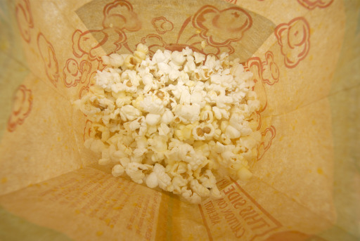 Looking down into a bag of microwaved popcorn