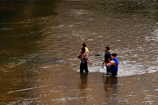 Photograph of Houston residents wading to safety after Hurricane Harvey