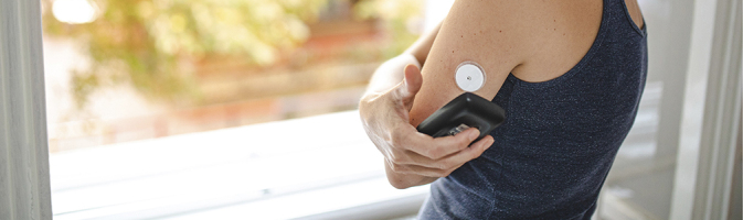 Fit young woman checking her blood sugar