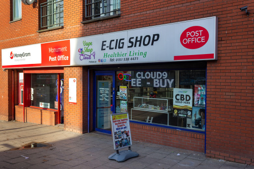 Photograph of a vape shop with a sign that reads “Healthier Living”