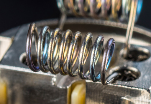 Closeup photograph of a metal e-cigarette coil