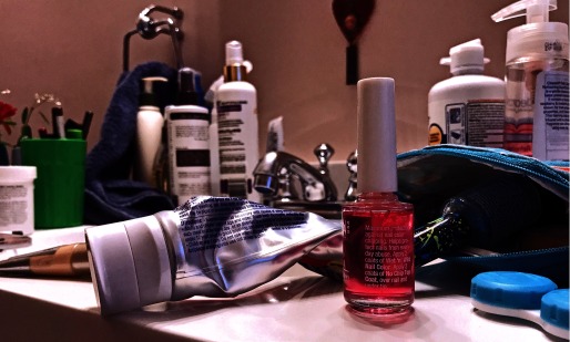 Photograph of assorted personal care products on a bathroom counter