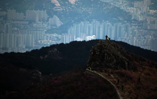 Photograph of a mountaintop overlooking hazy downtown Busan, South Korea