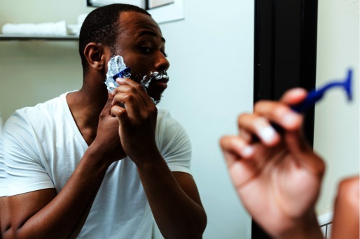 Photograph of a man shaving