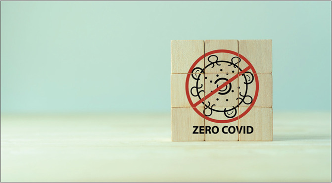 Medical and Covid-19 zero covid concept. Coronavirus virus cell symbolic. The wooden cubes with ZERO COVID icon on grey background and copy space. Covid-19 zero covid concept.