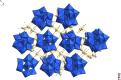 Drawing of a crystal structure of the {PMo12O40}3- Keggin anion shown by the blue polyhedra with sodium ions connecting the anions together in a three-dimensional lattice.
