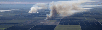 Aerial image of smoke plumes rising from burning sugarcane fields in South Florida.