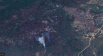 The Roro hill top with mine waste deposits at multiple locations