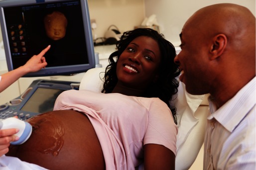 Photograph of a husband and wife during a fetal ultrasound