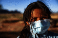Navajo child wearing a surgical mask