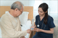 Nurse checking with fingertip pulse oximeter oxygen saturation meter SPO2 PR blood monitor finger to middle aged adult patient man,Home care nurse service