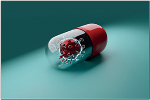 Computer rendering of a pill capsule with enlarged coronavirus particles inside.