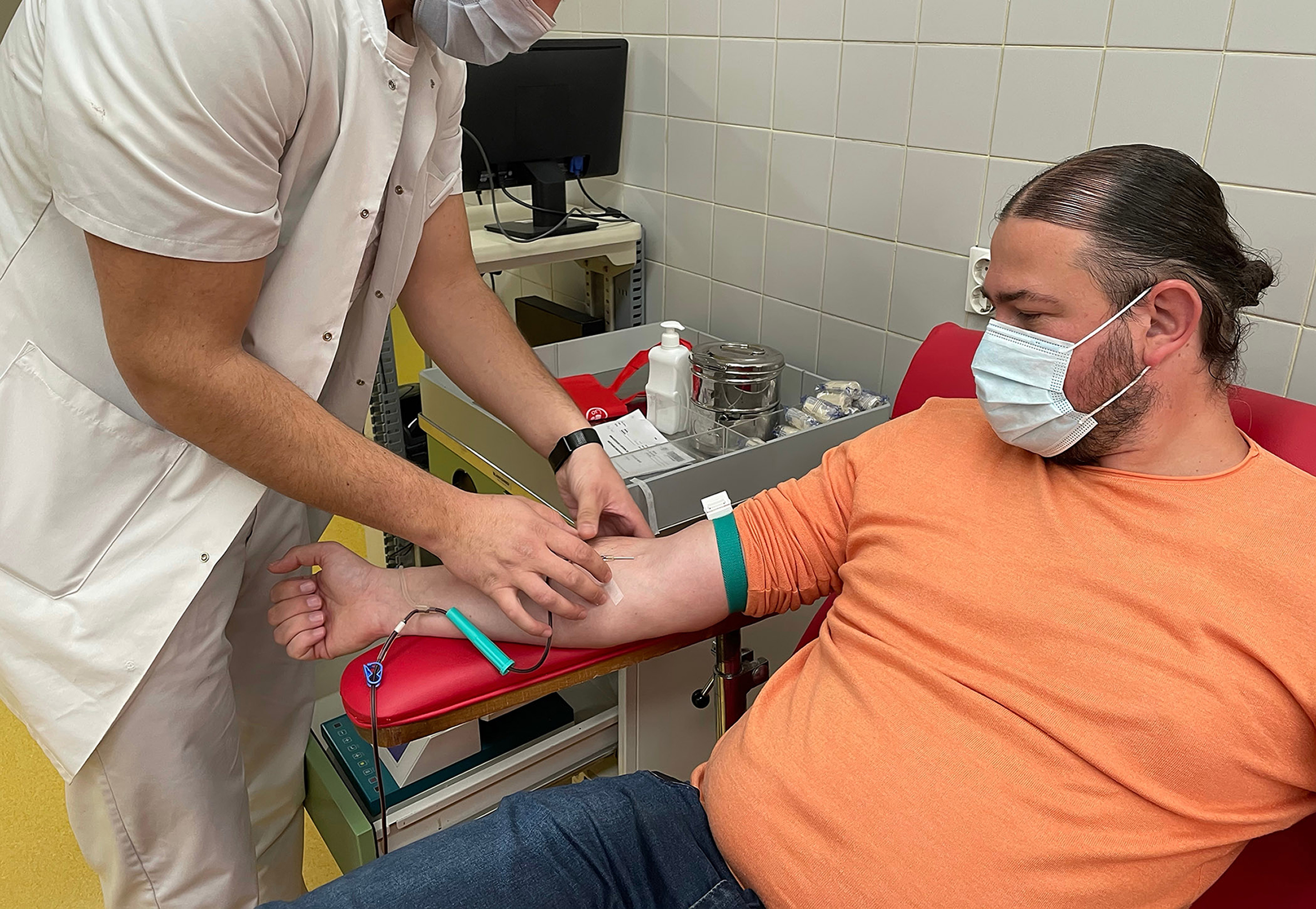 A man giving a blood sample