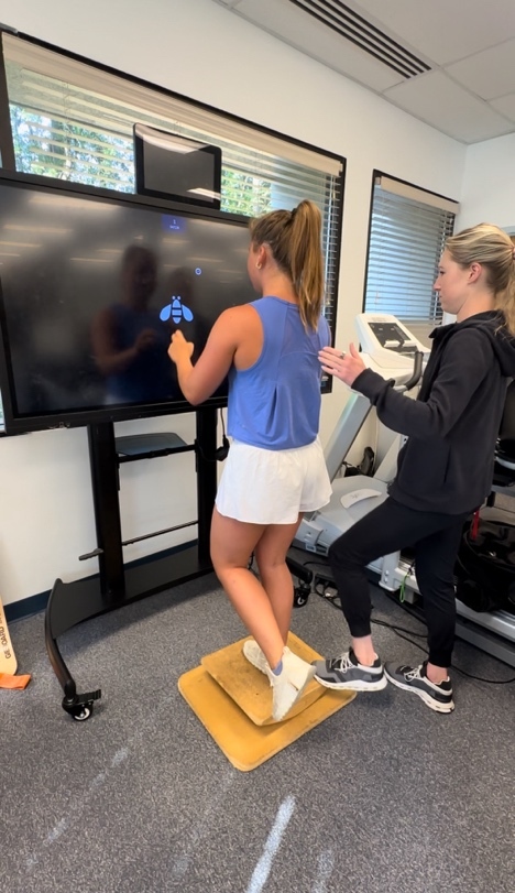 A person standing on a step on a treadmill Description automatically generated