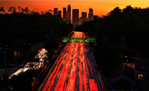 Photograph of highway traffic near a house outside Los Angeles